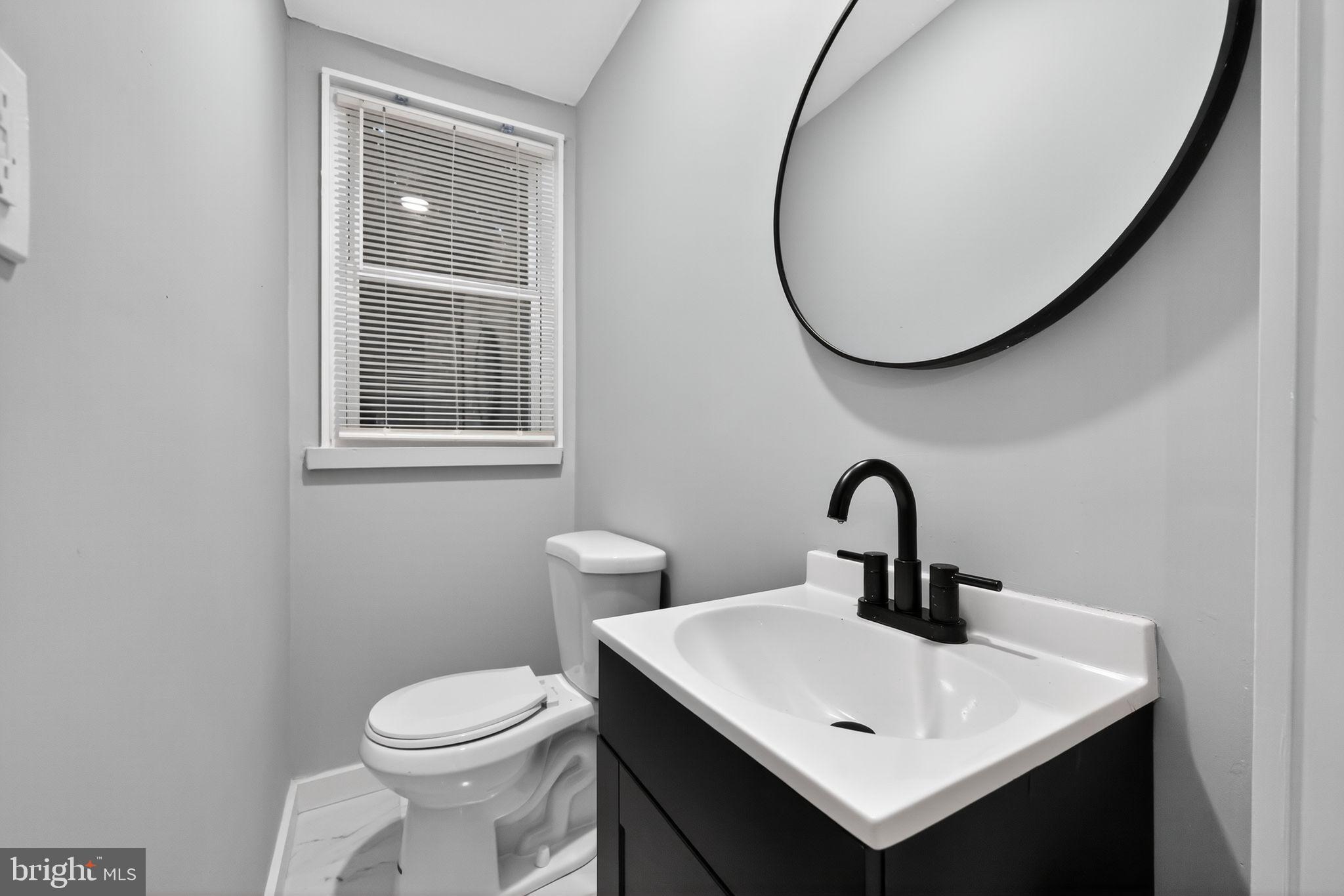 1433 North Chesapeake Road Camden, NJ 08104 - Photo 11 of 15 a bathroom with a sink and a mirror