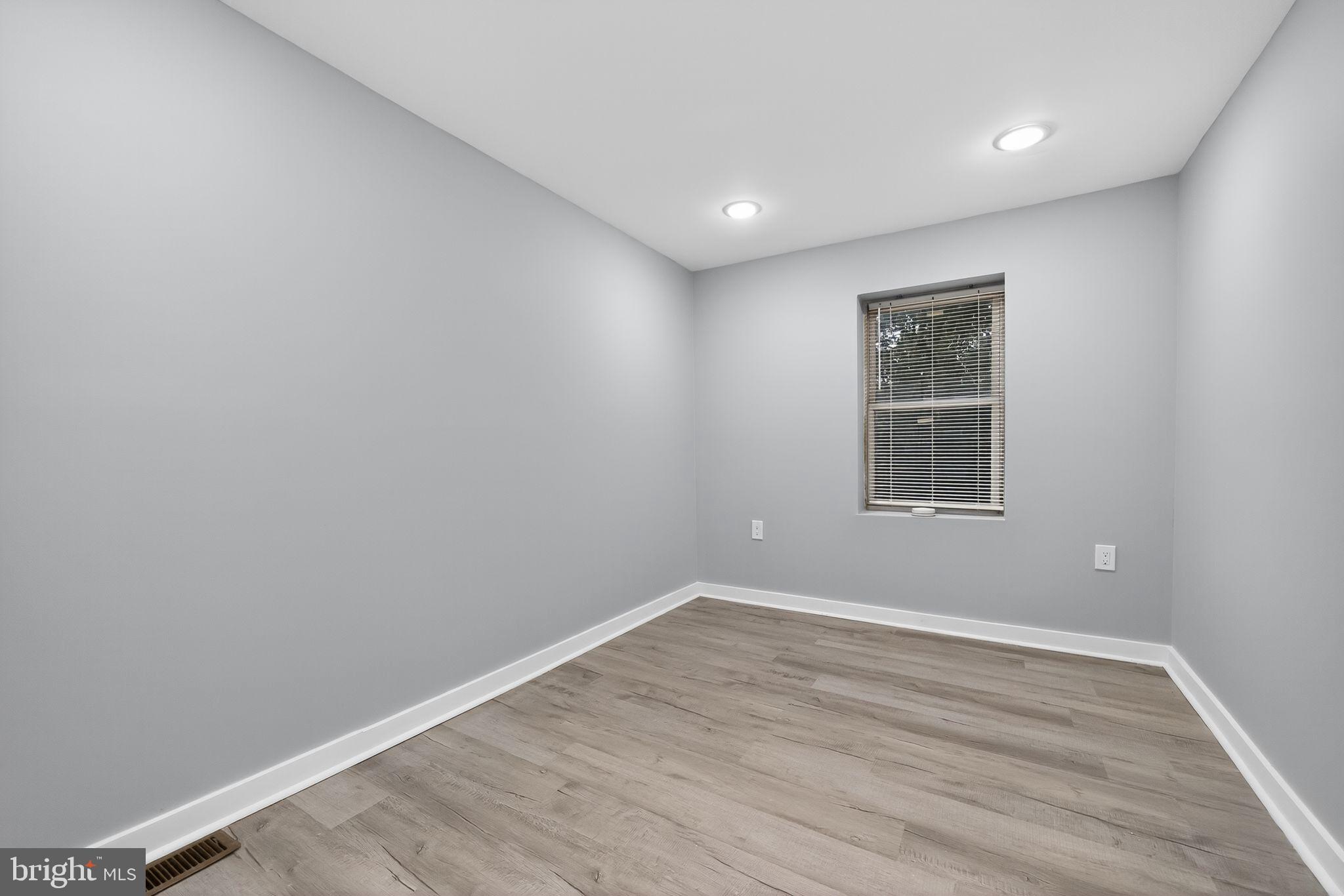 1433 North Chesapeake Road Camden, NJ 08104 - Photo 9 of 15 a view of empty room with wooden floor and fan