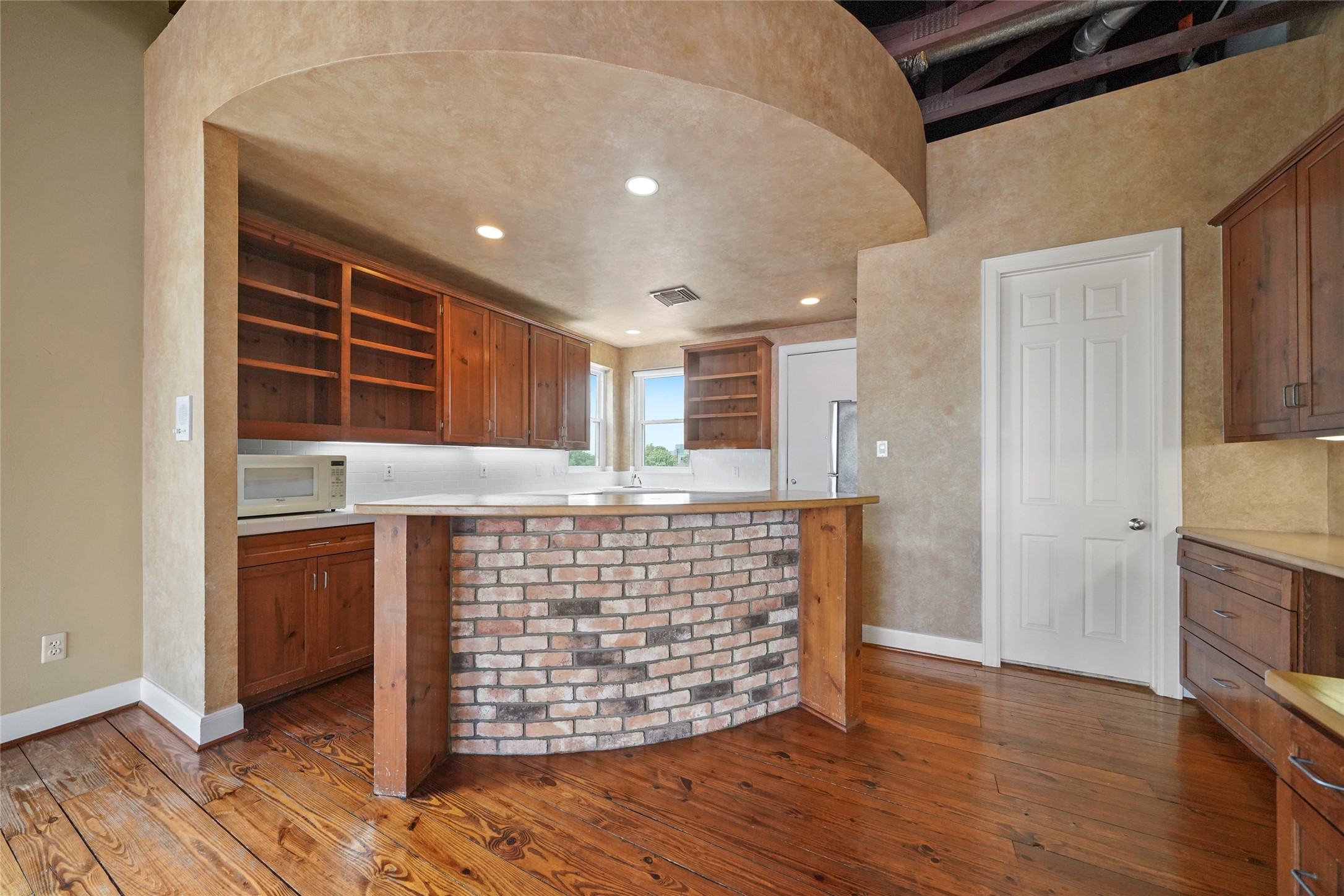 1514 Stanford Street Houston, TX 77019 - Photo 13 of 34 a view of empty room with wooden floor and window