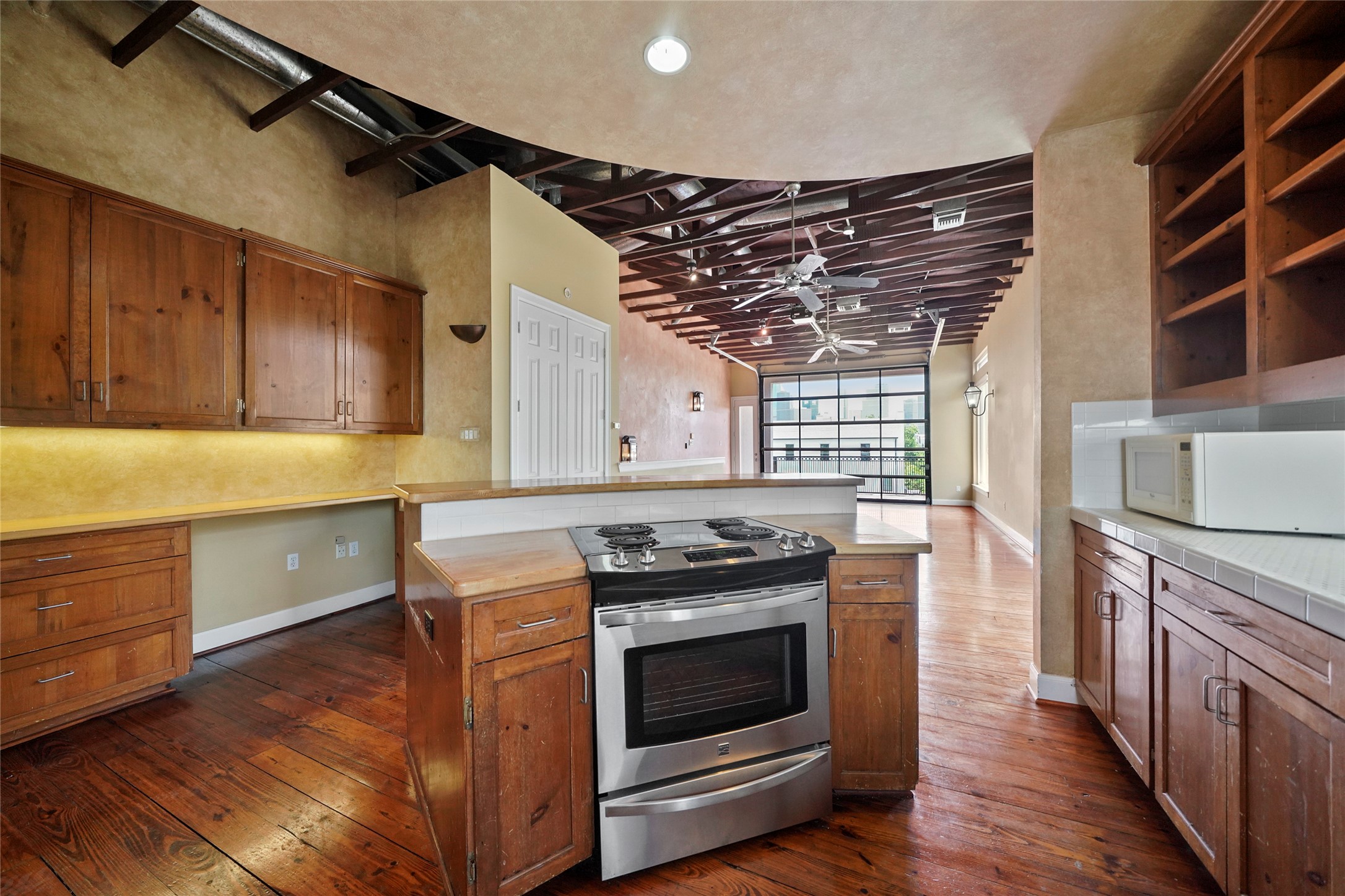 1514 Stanford Street Houston, TX 77019 - Photo 15 of 34 a kitchen with a stove and a refrigerator