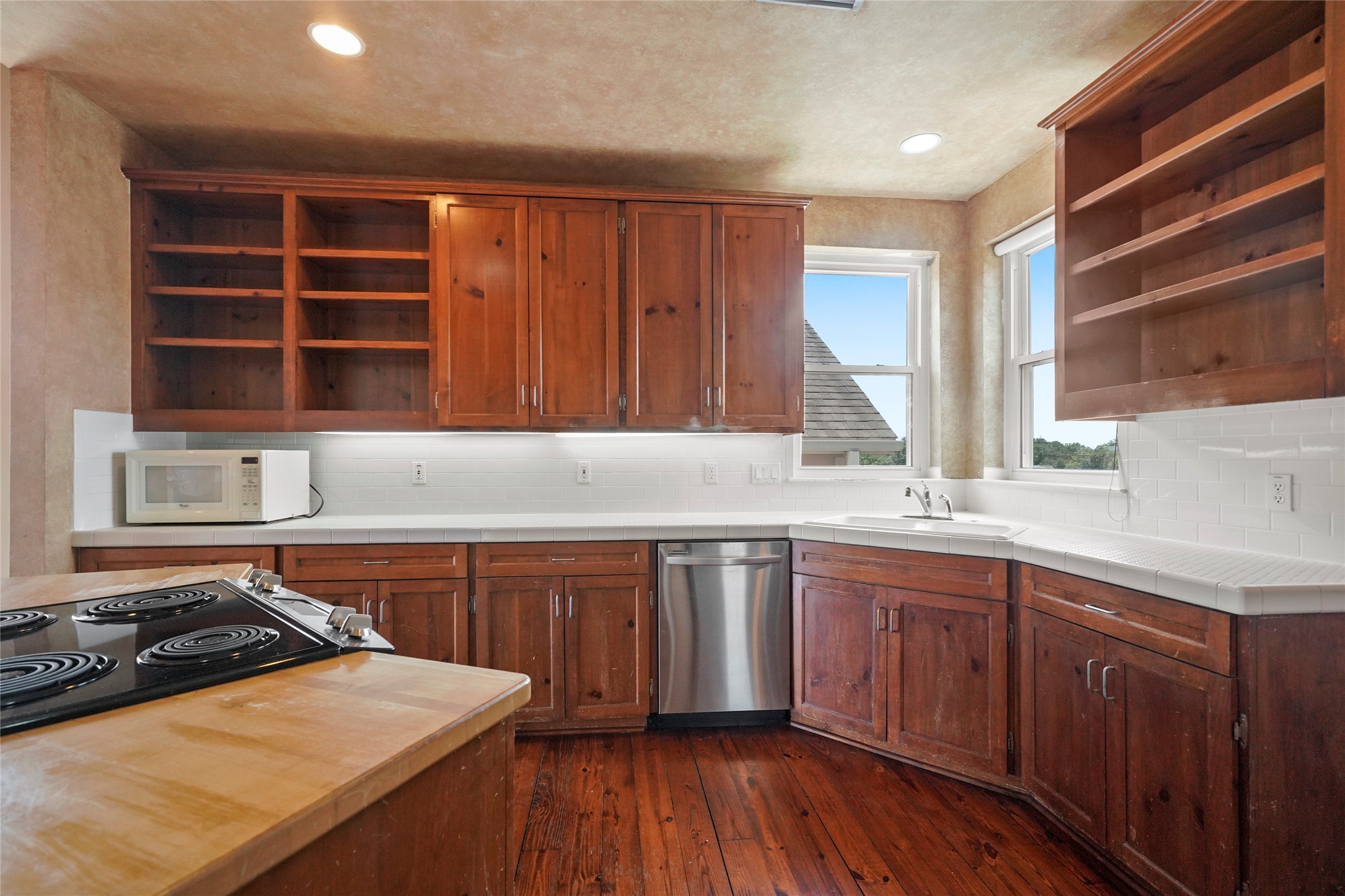 1514 Stanford Street Houston, TX 77019 - Photo 17 of 34 a kitchen with a sink stove and cabinets