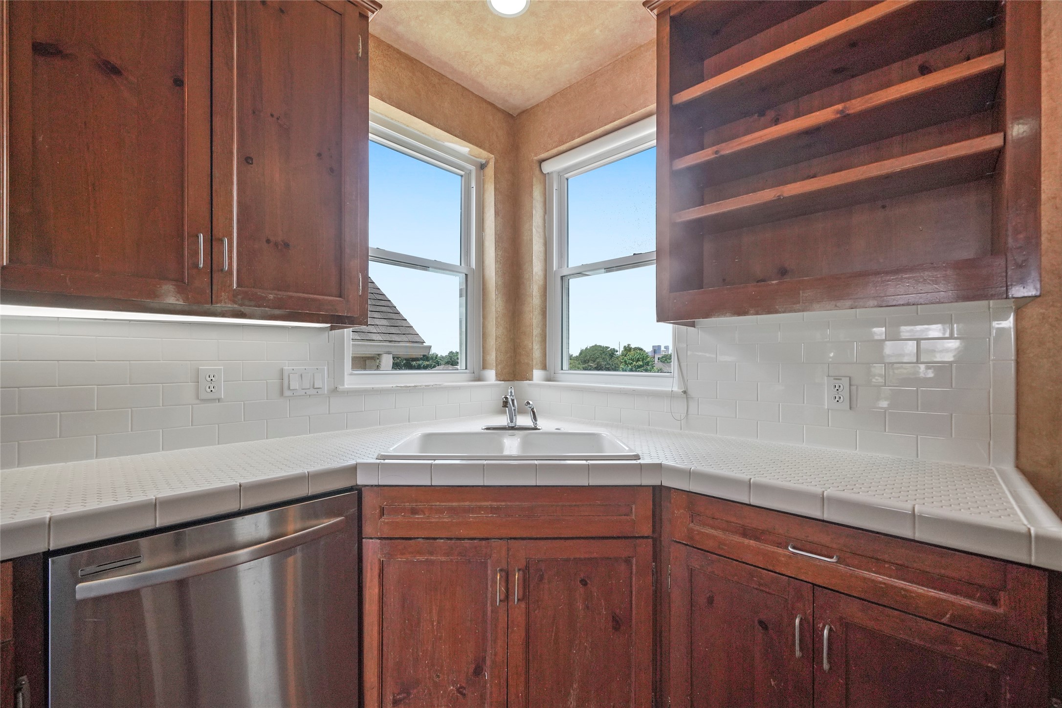 1514 Stanford Street Houston, TX 77019 - Photo 18 of 34 a kitchen with a sink and cabinets