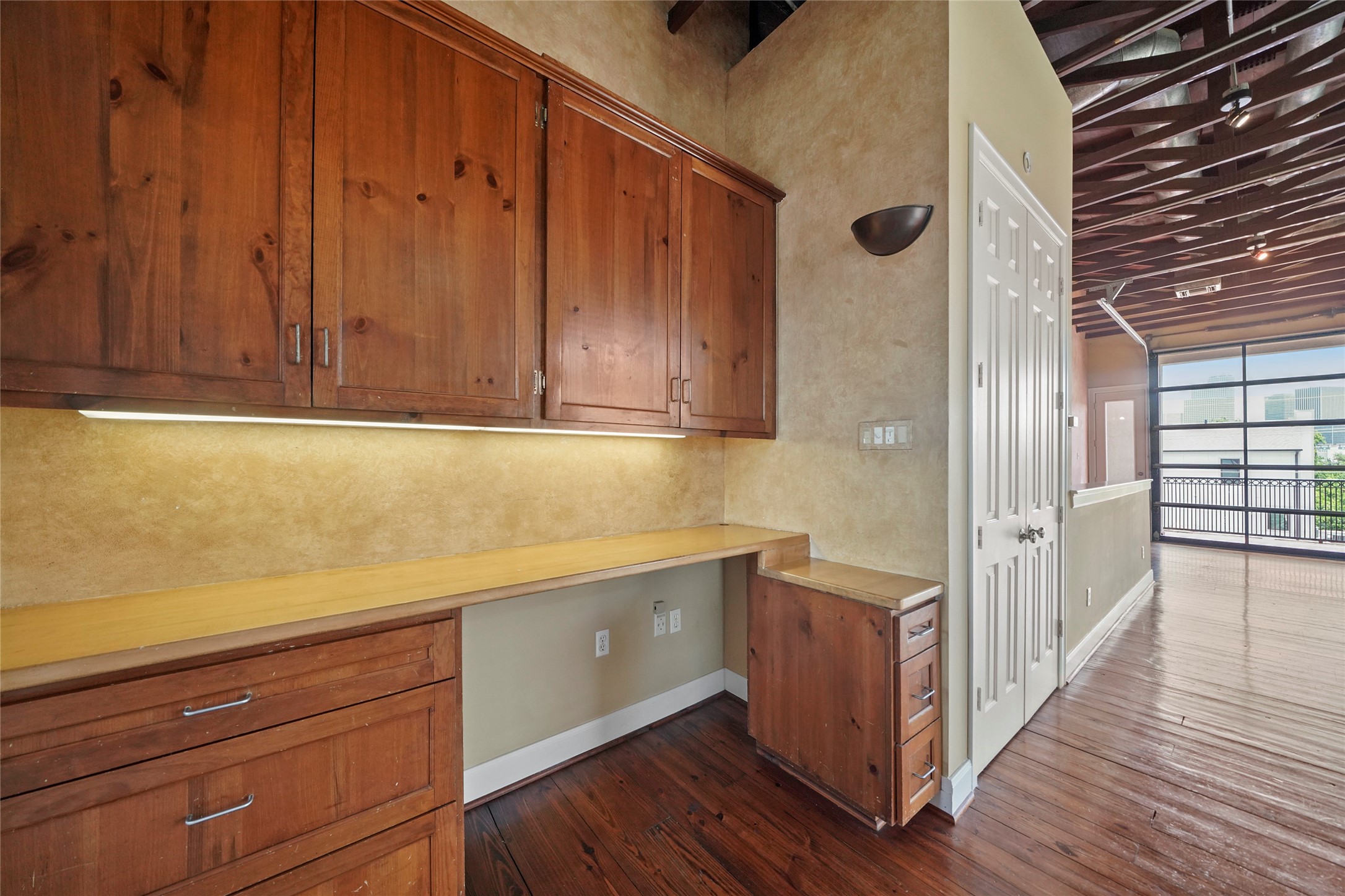 1514 Stanford Street Houston, TX 77019 - Photo 19 of 34 a view of a hallway with wooden floor and cabinet