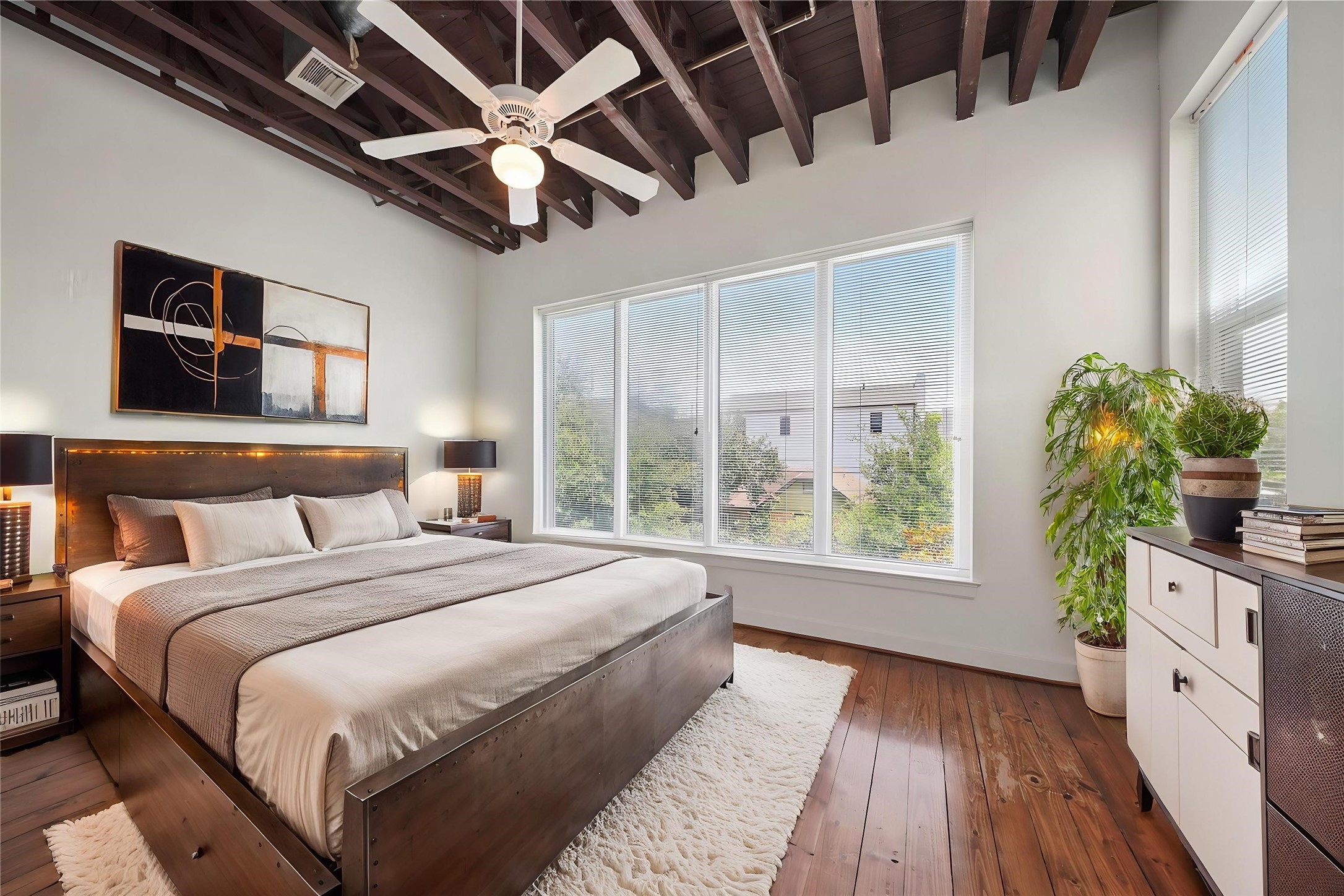 1514 Stanford Street Houston, TX 77019 - Photo 22 of 34 a large bed sitting in a bedroom next to a window