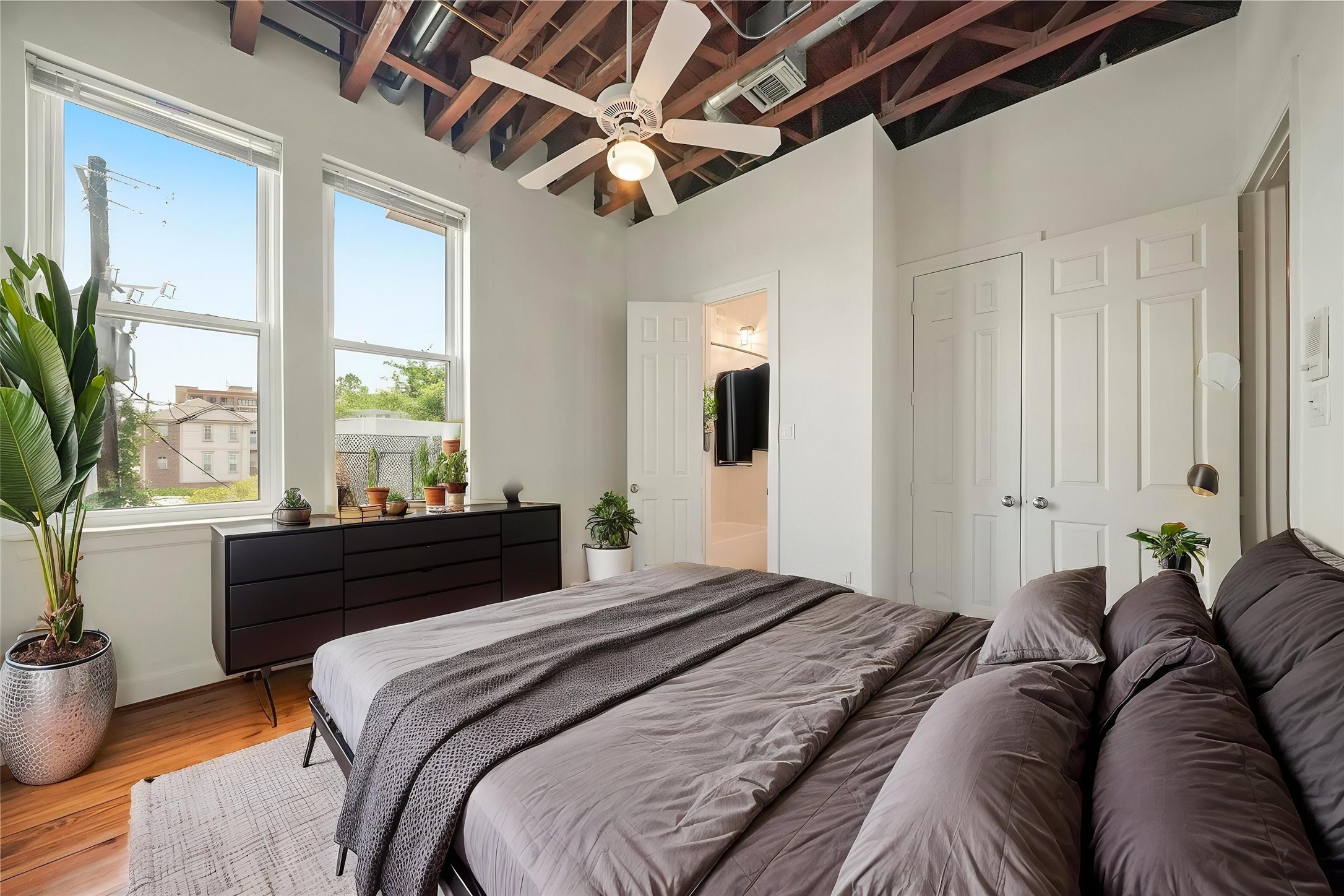 1514 Stanford Street Houston, TX 77019 - Photo 28 of 34 a bedroom with a large bed and a large window