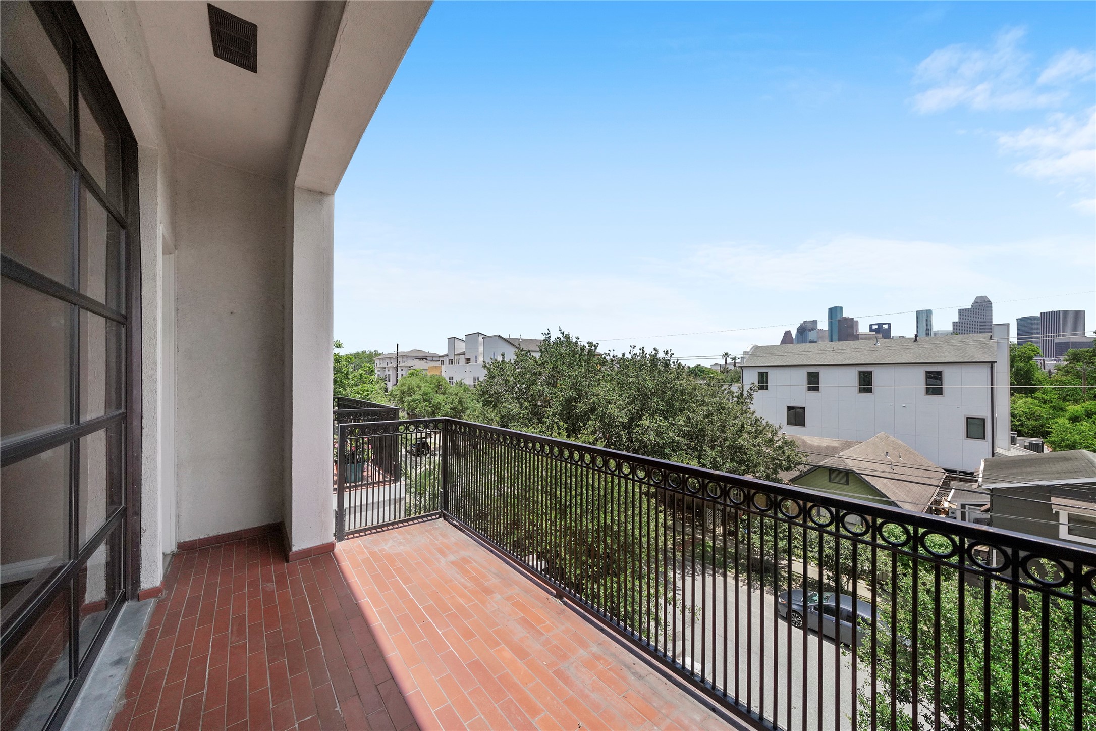 1514 Stanford Street Houston, TX 77019 - Photo 33 of 34 a view of balcony with wooden floor and fence
