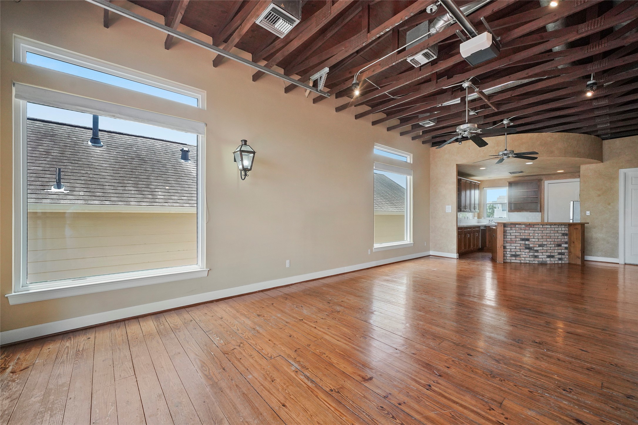 1514 Stanford Street Houston, TX 77019 - Photo 10 of 34 a view of empty room with wooden floor and fireplace