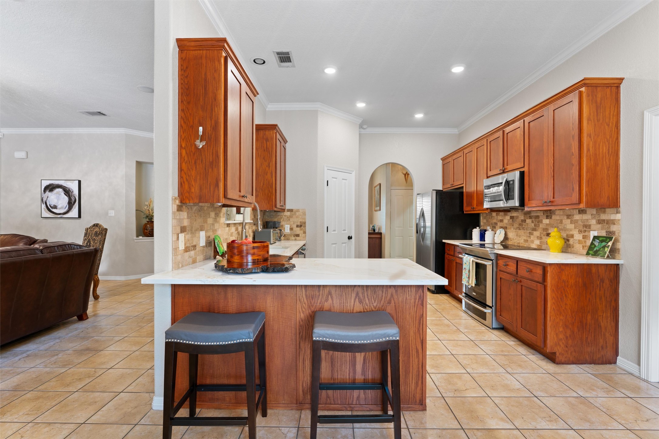 223 East Ridgewood Road Georgetown, TX 78633 - Photo 9 of 40 This kitchen showcases rich wood cabinetry