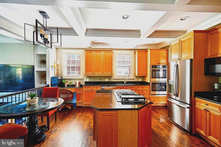 20366 Fallsway Terrace Sterling, VA 20165 - Photo 21 of 45 a kitchen with stainless steel appliances granite countertop a sink a stove and a refrigerator