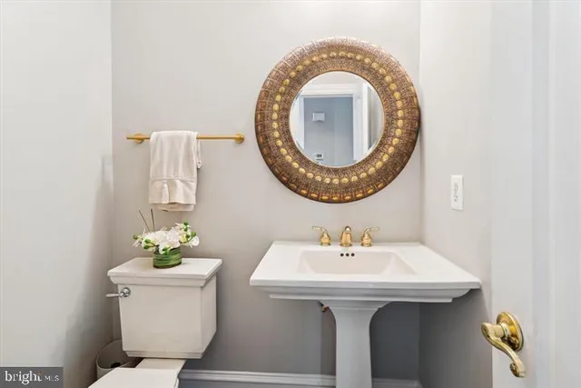 a bedroom with a large bed and a flat tv screen