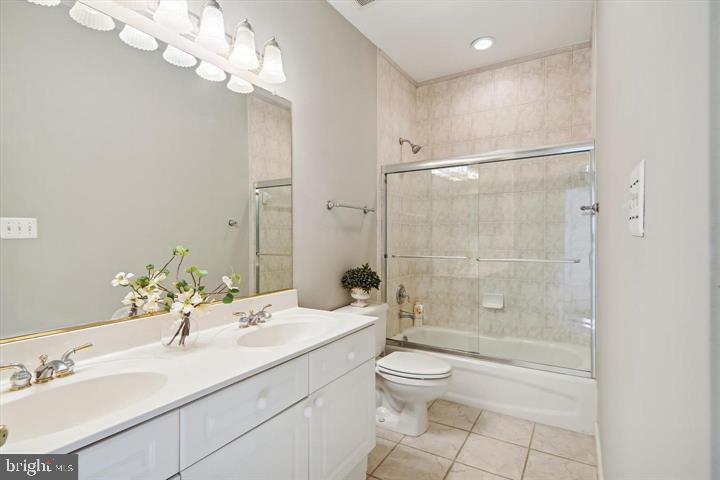 20366 Fallsway Terrace Sterling, VA 20165 - Photo 30 of 45 a bathroom with a sink a toilet and shower