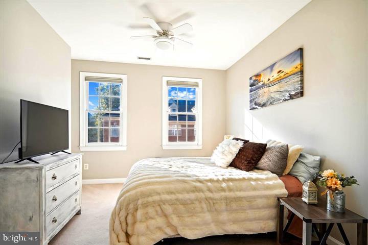 20366 Fallsway Terrace Sterling, VA 20165 - Photo 31 of 45 a bedroom with a bed and a flat screen tv