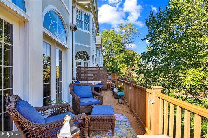 20366 Fallsway Terrace Sterling, VA 20165 - Photo 39 of 45 a view of a patio with couches chairs and a potted plant