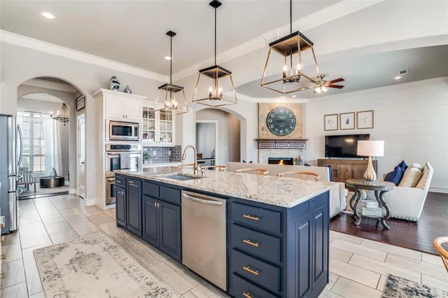 a large kitchen with cabinets and outdoor seating