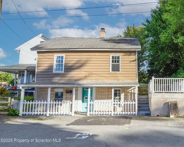 a front view of a house with a outdoor space