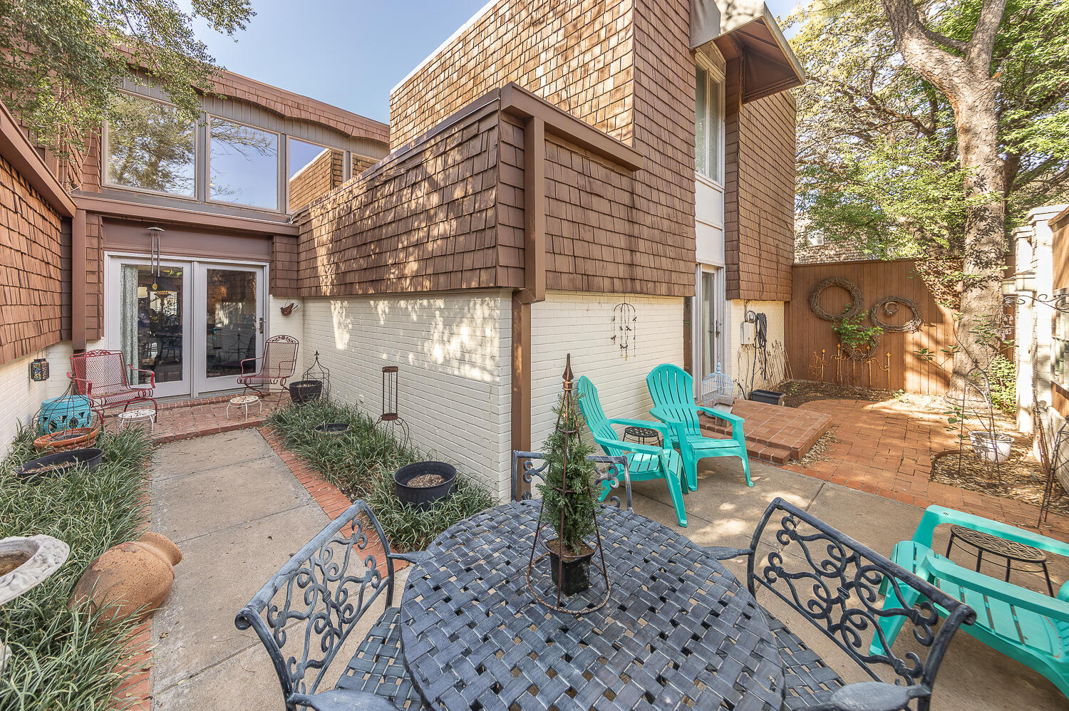 2302 Slide Road, Unit 25 Lubbock, TX 79407 - Photo 26 of 40 a view of a chair and table in the patio