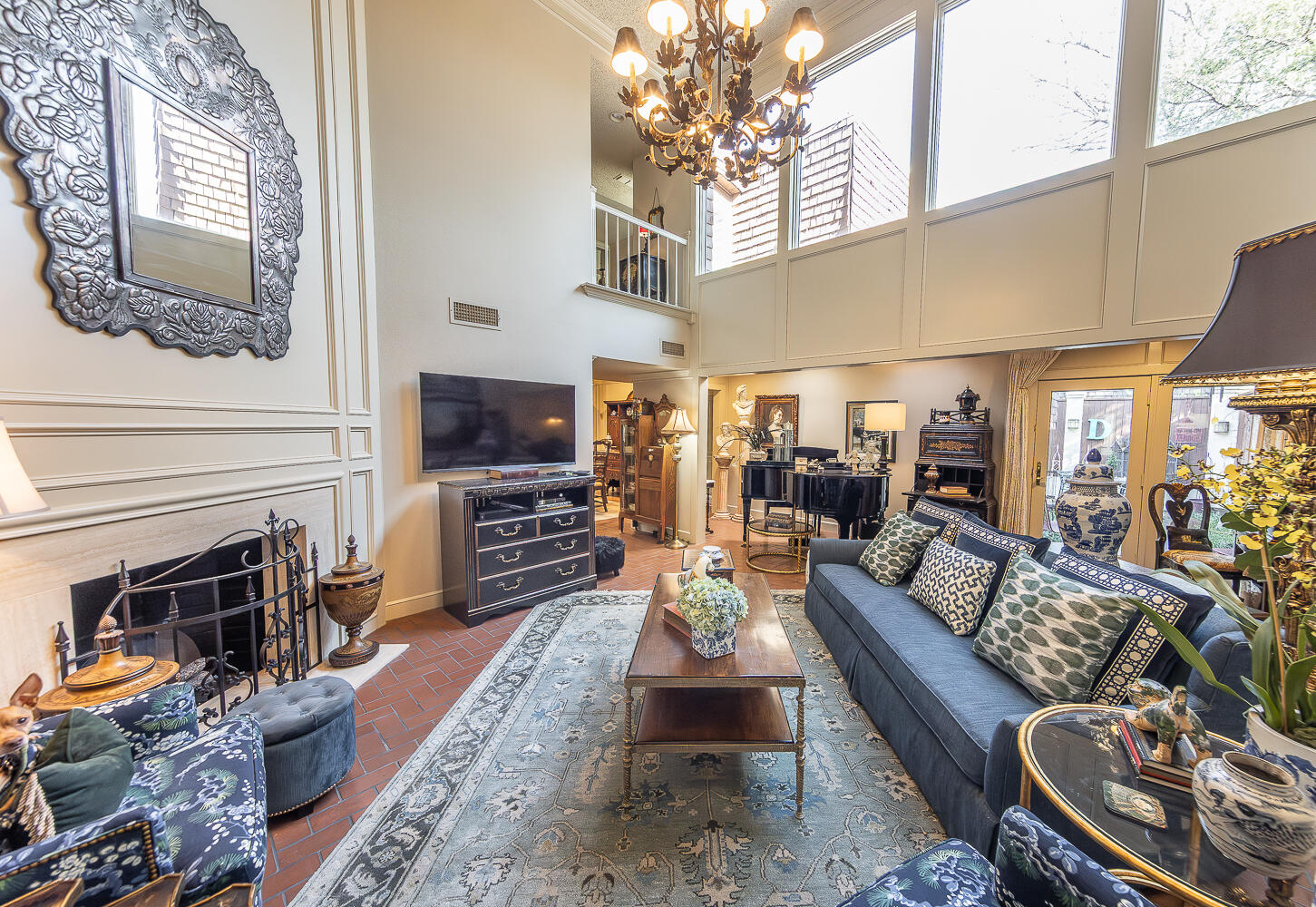 2302 Slide Road, Unit 25 Lubbock, TX 79407 - Photo 6 of 40 a living room with furniture a fireplace and a flat screen tv