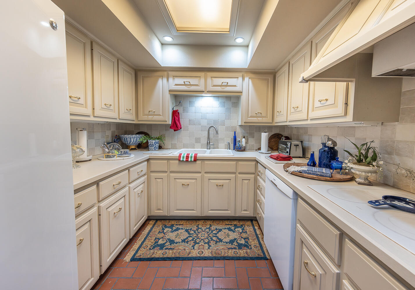 2302 Slide Road, Unit 25 Lubbock, TX 79407 - Photo 8 of 40 a kitchen with kitchen island granite countertop lots of counter top space and sink