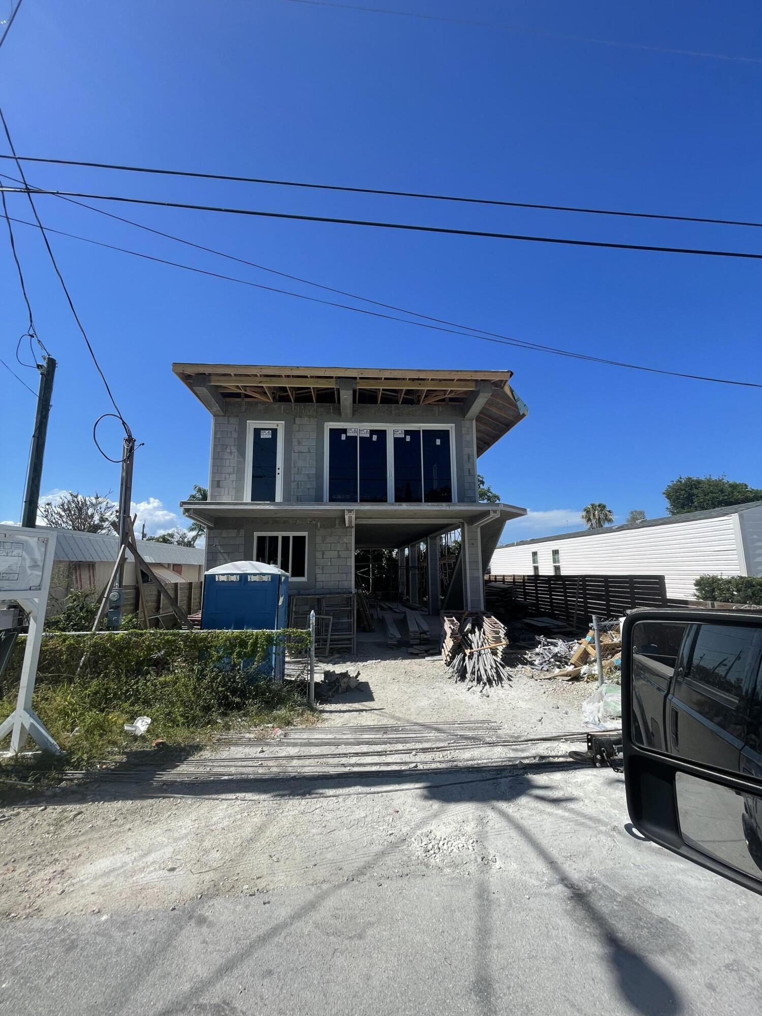 129 2nd Court Key Largo, FL 33037 - Photo 2 of 2 a view of a building with chairs