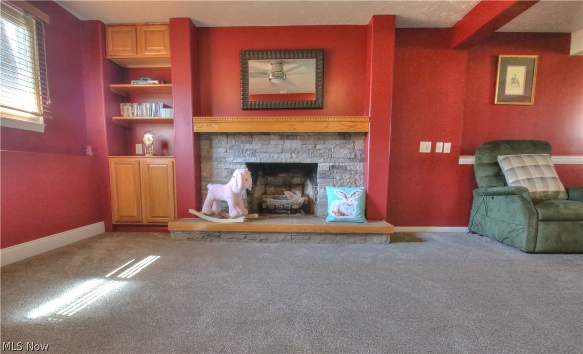 7730 Chillicothe Road Mentor, OH 44060 - Photo 24 of 35 Cozy lower level with gas fireplace.