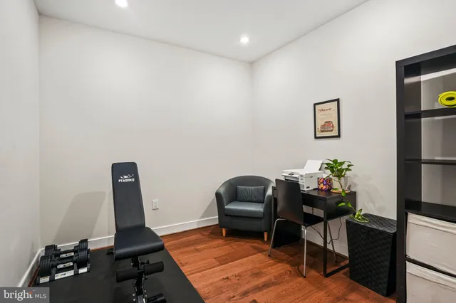 a work room with furniture and wooden floor