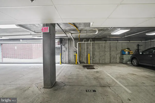a view of parking garage with cars