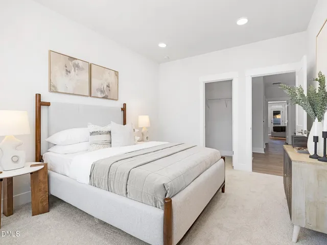 a bed room with a bed and a painting