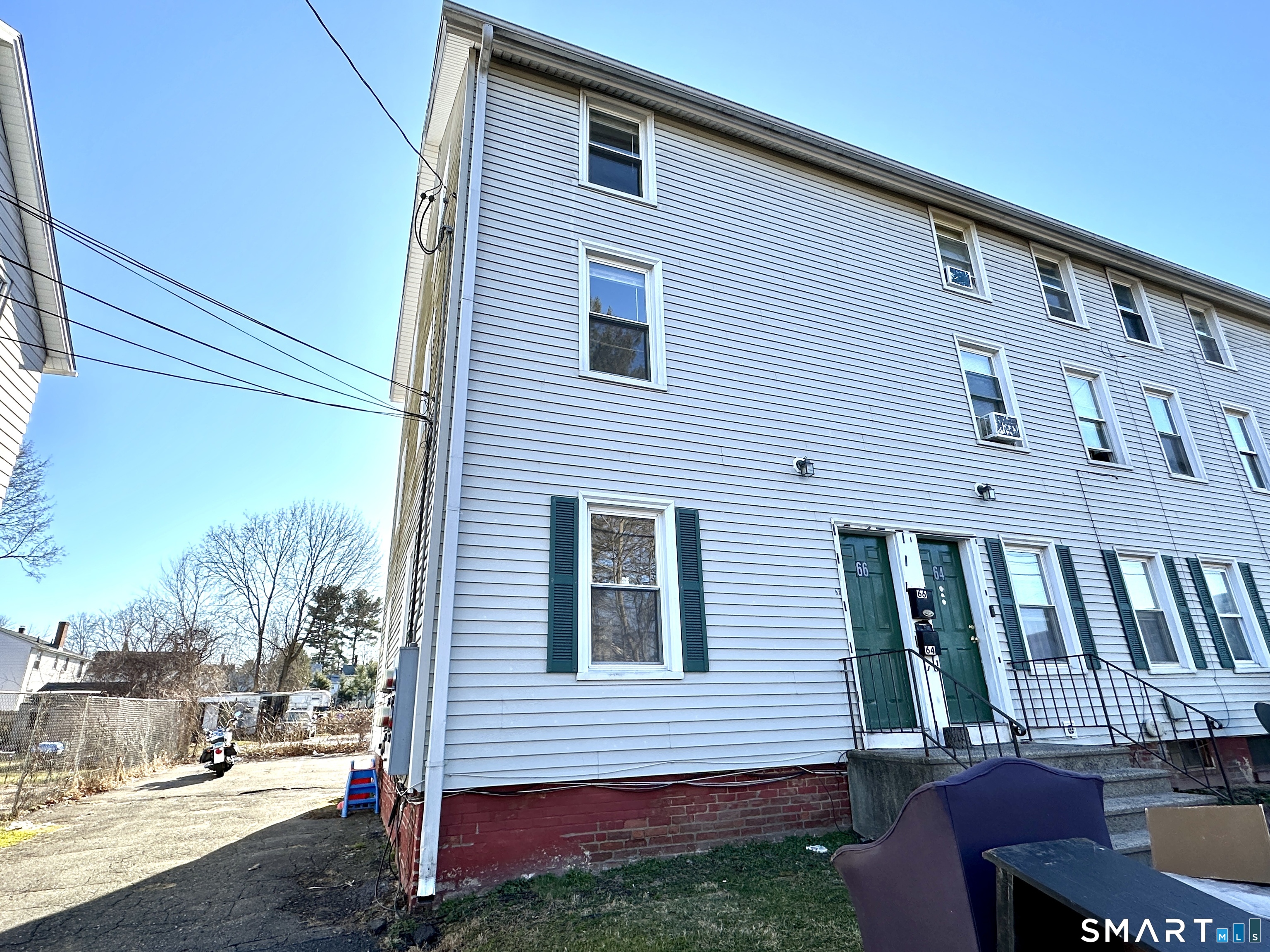 60 Tariff Street, Unit 66 Enfield, CT 06082 - Photo 1 of 1 a front view of a house with garden