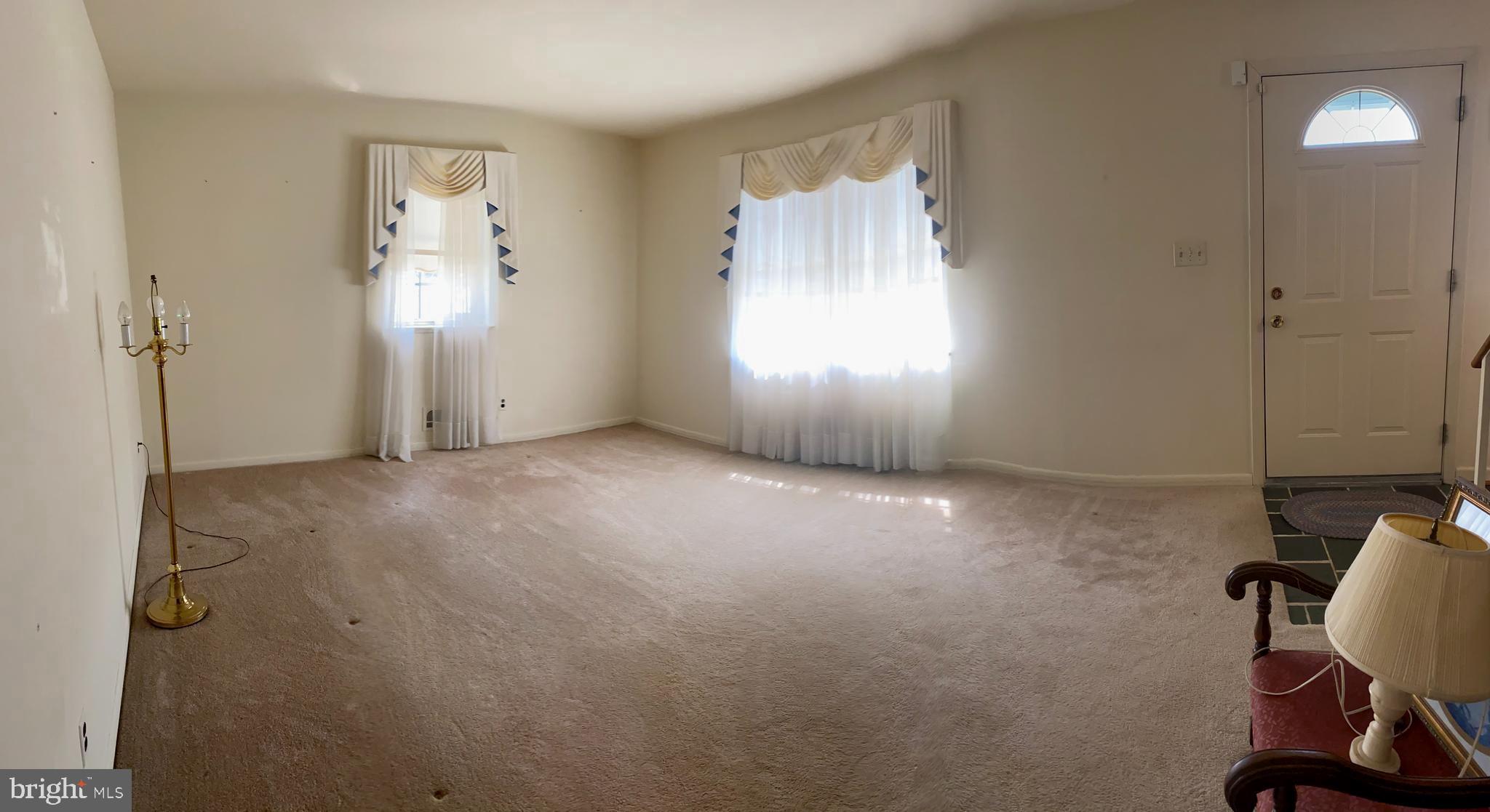 706 Crosby Road Baltimore, MD 21228 - Photo 15 of 89 Formal living room is neutral, wood floors under