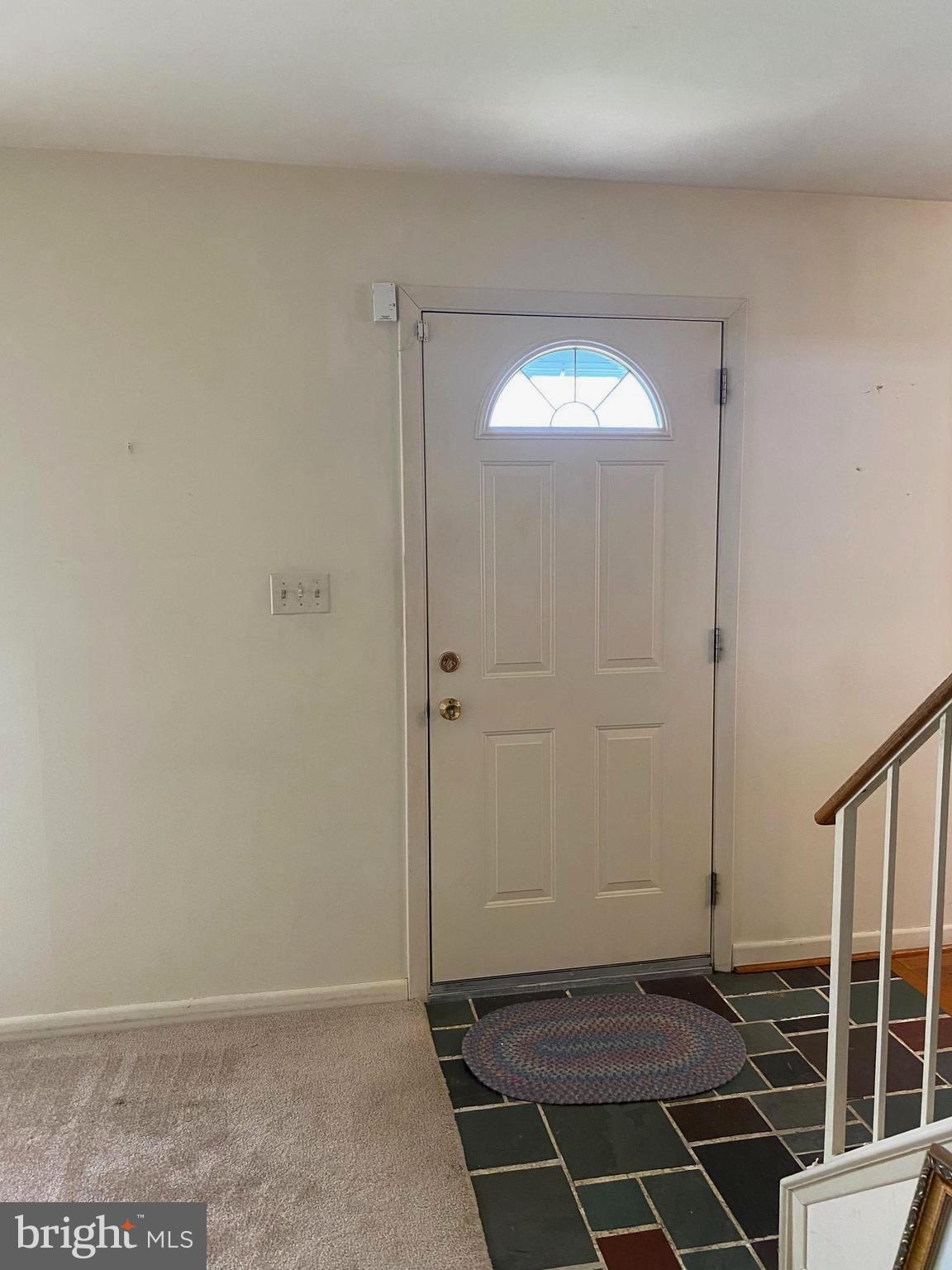 706 Crosby Road Baltimore, MD 21228 - Photo 28 of 89 View as you enter, slate tile, steel door