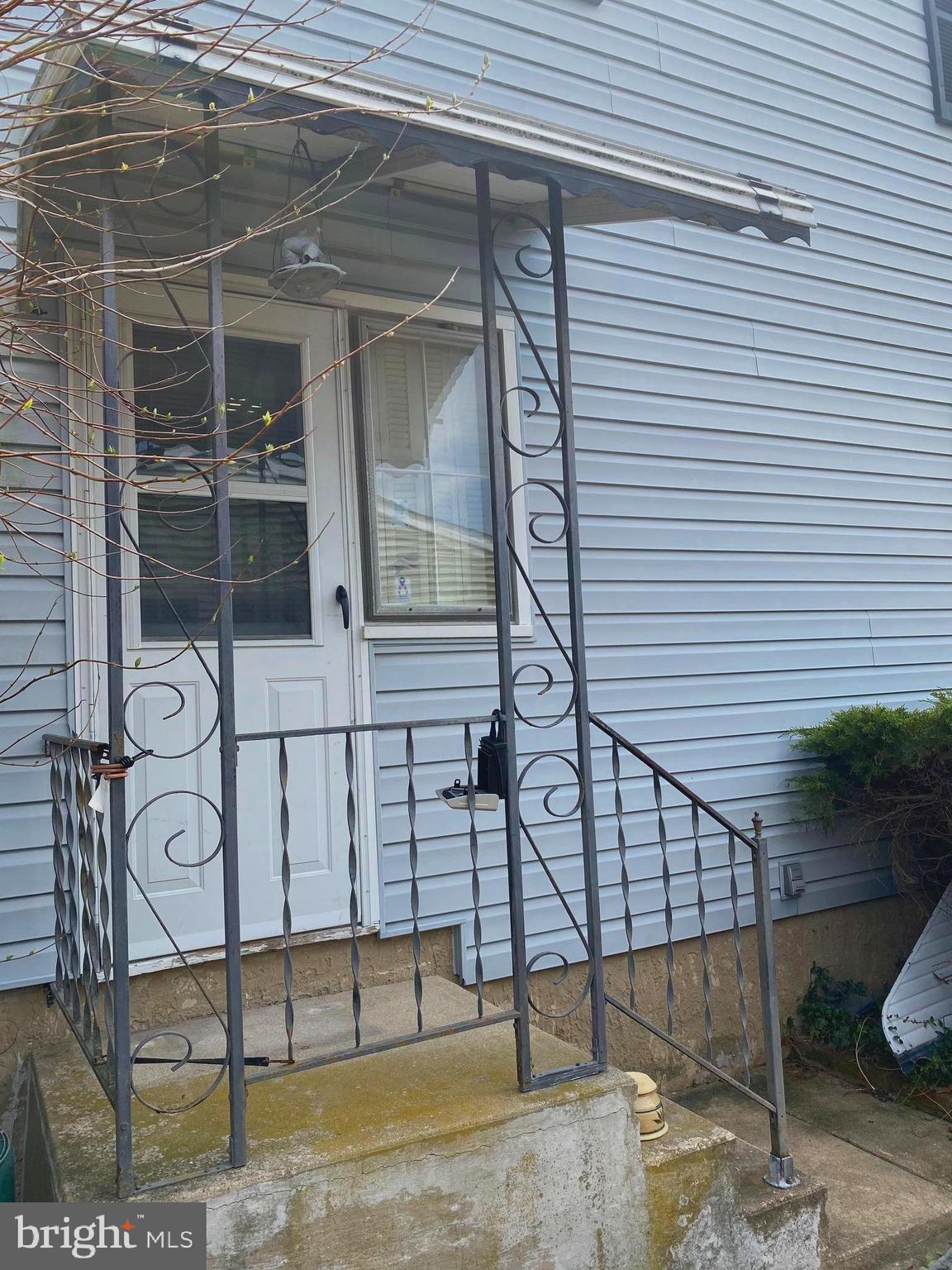 706 Crosby Road Baltimore, MD 21228 - Photo 5 of 89 side door from parking pad is convenient