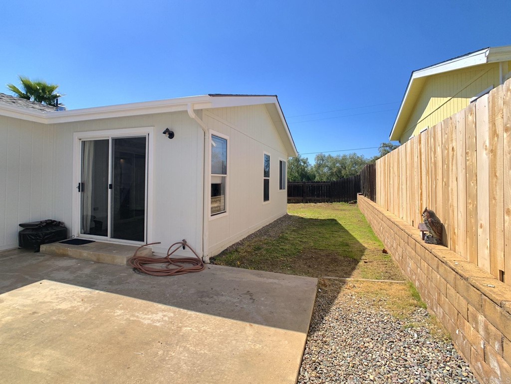 15935 Spring Oaks Road, Unit 63 El Cajon, CA 92021 - Photo 28 of 38 a view of a house with backyard