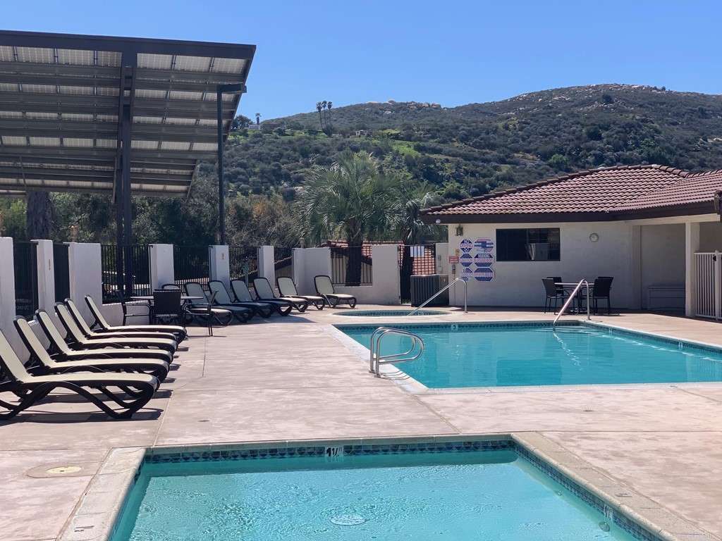 15935 Spring Oaks Road, Unit 63 El Cajon, CA 92021 - Photo 34 of 38 a view of a patio with chairs and plants