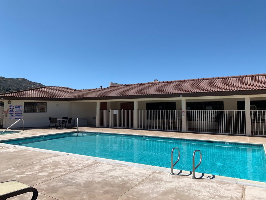 15935 Spring Oaks Road, Unit 63 El Cajon, CA 92021 - Photo 36 of 38 a view of a house with a backyard