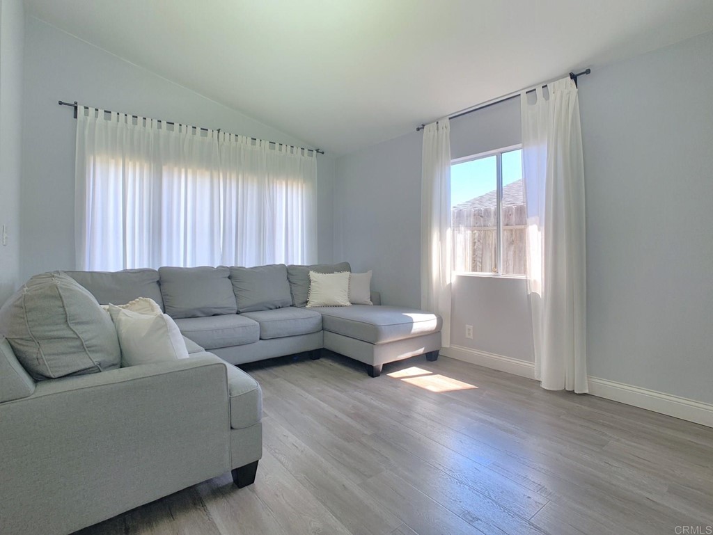 15935 Spring Oaks Road, Unit 63 El Cajon, CA 92021 - Photo 4 of 38 a living room with furniture and a window