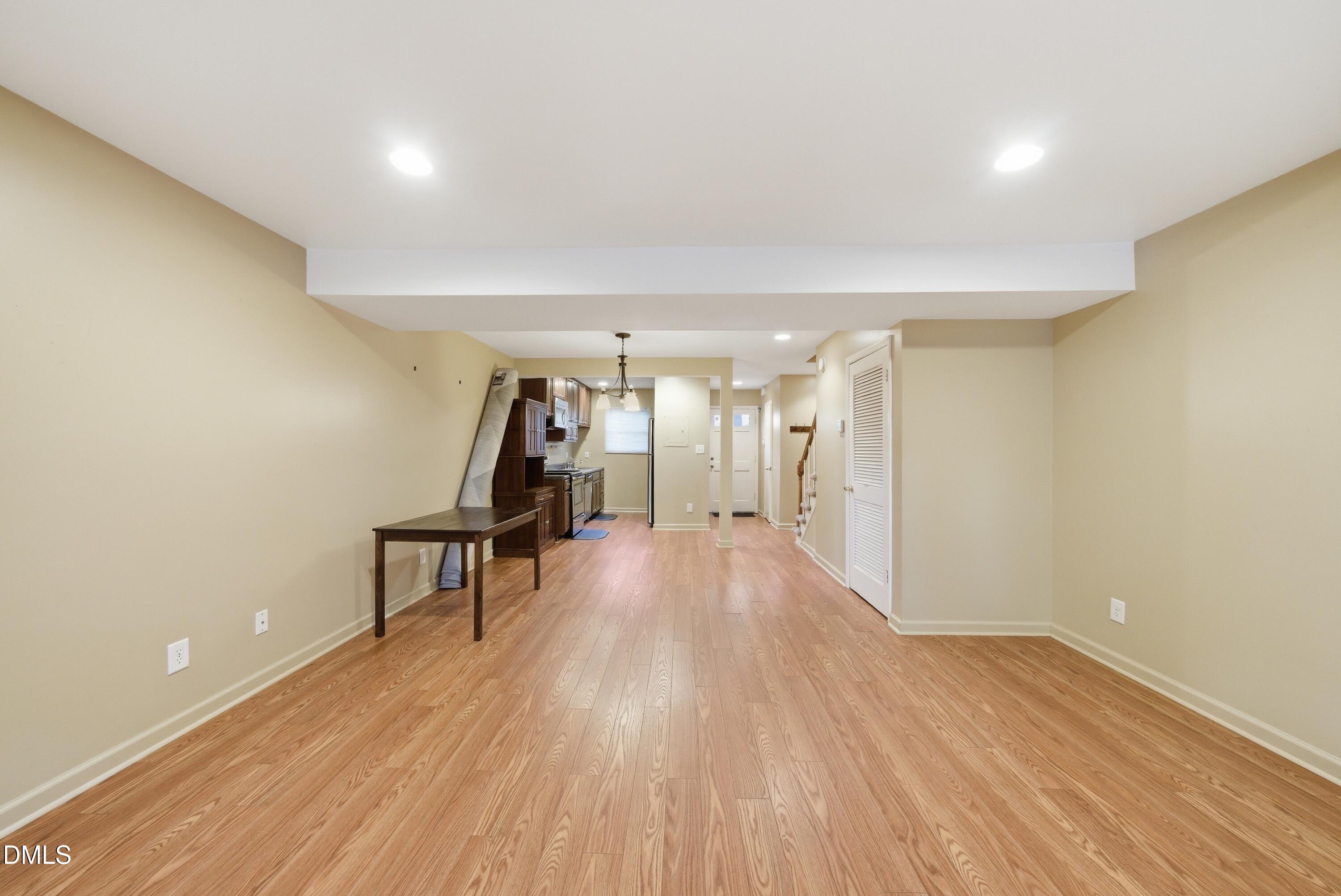 6355 New Market Way Raleigh, NC 27615 - Photo 20 of 30 a view of a room with wooden floor table and chairs