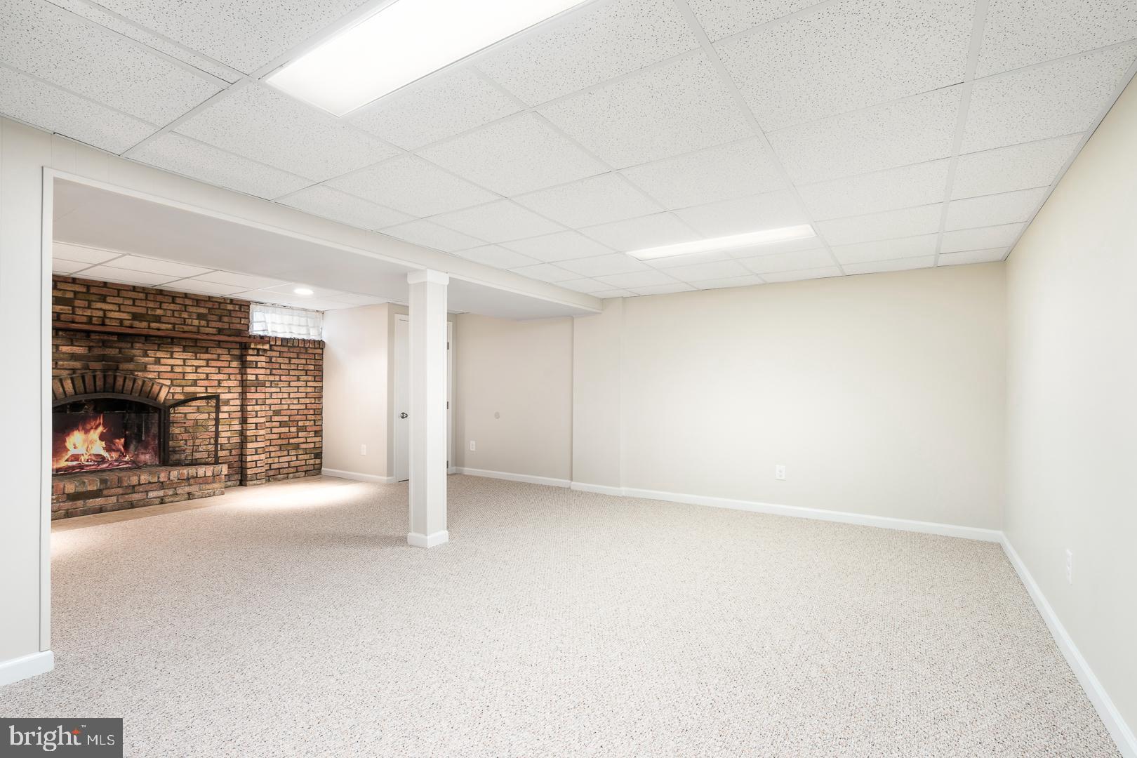 25 Mill Bend Road Trenton, NJ 08690 - Photo 22 of 28 Finished basement with wood burning fireplace