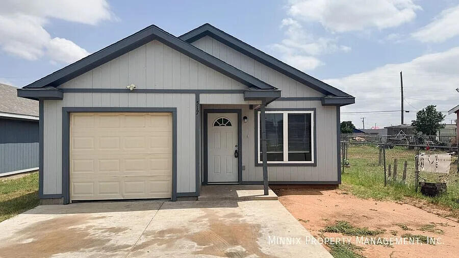 517 44th Street Lubbock, TX 79404 - Photo 1 of 10 a front view of a house with a yard