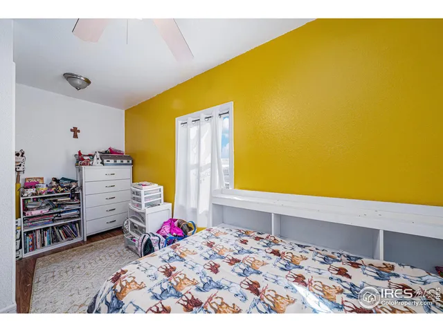 a bed room with a bed and toys