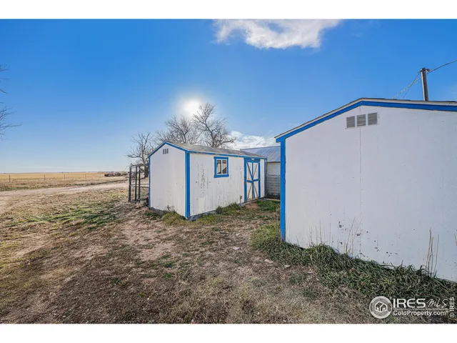 a view of a backyard of the house