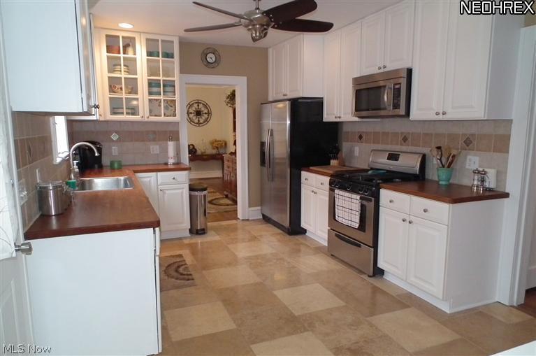 3387 Ingleside Road Shaker Heights, OH 44122 - Photo 2 of 16 UPDATED EAT-IN KITCHEN WITH TRAVERTENE FLOORING AND ALL NEW STAINLESS STEEL APPLIANCES
