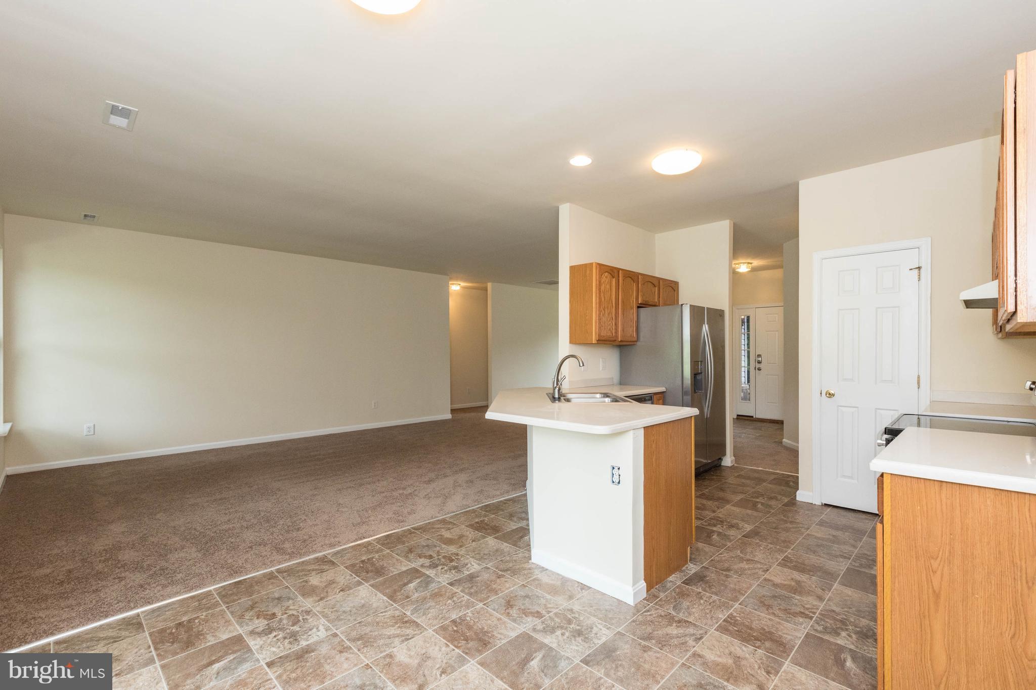 11207 Rawhide Road Lusby, MD 20657 - Photo 11 of 25 a view of a kitchen with a sink