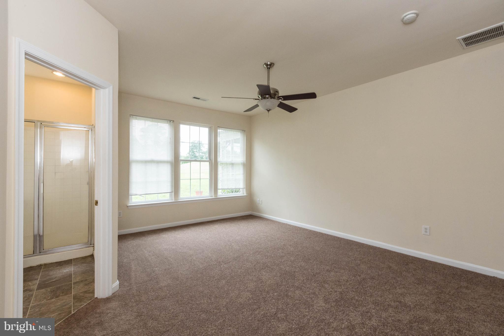 11207 Rawhide Road Lusby, MD 20657 - Photo 13 of 25 a view of an empty room with a window