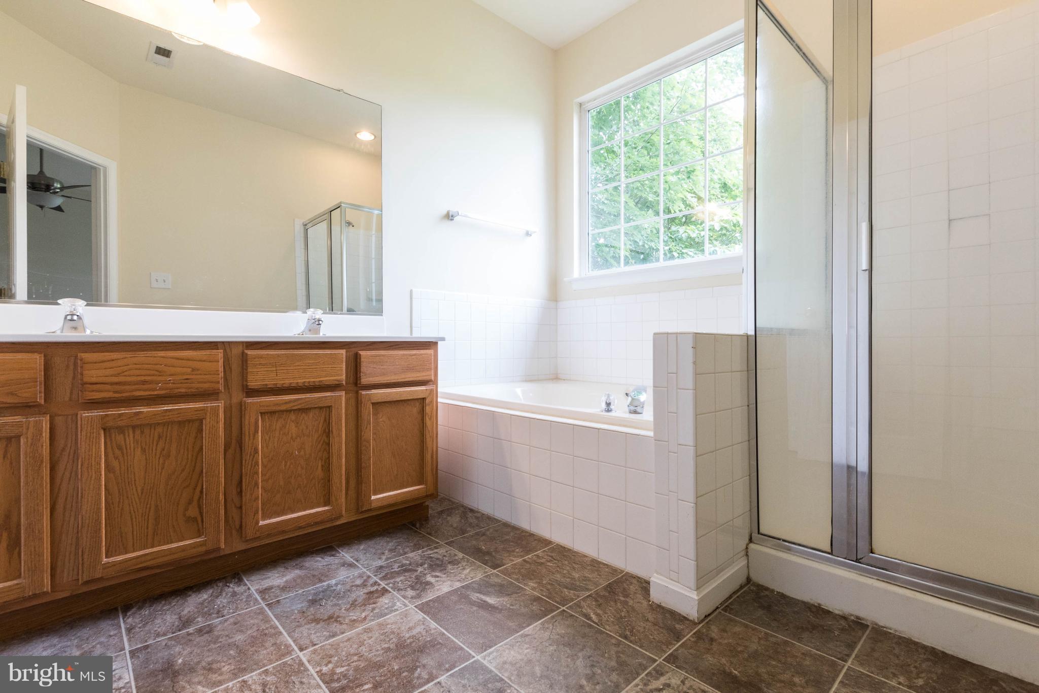 11207 Rawhide Road Lusby, MD 20657 - Photo 15 of 25 a room with a cabinets and window