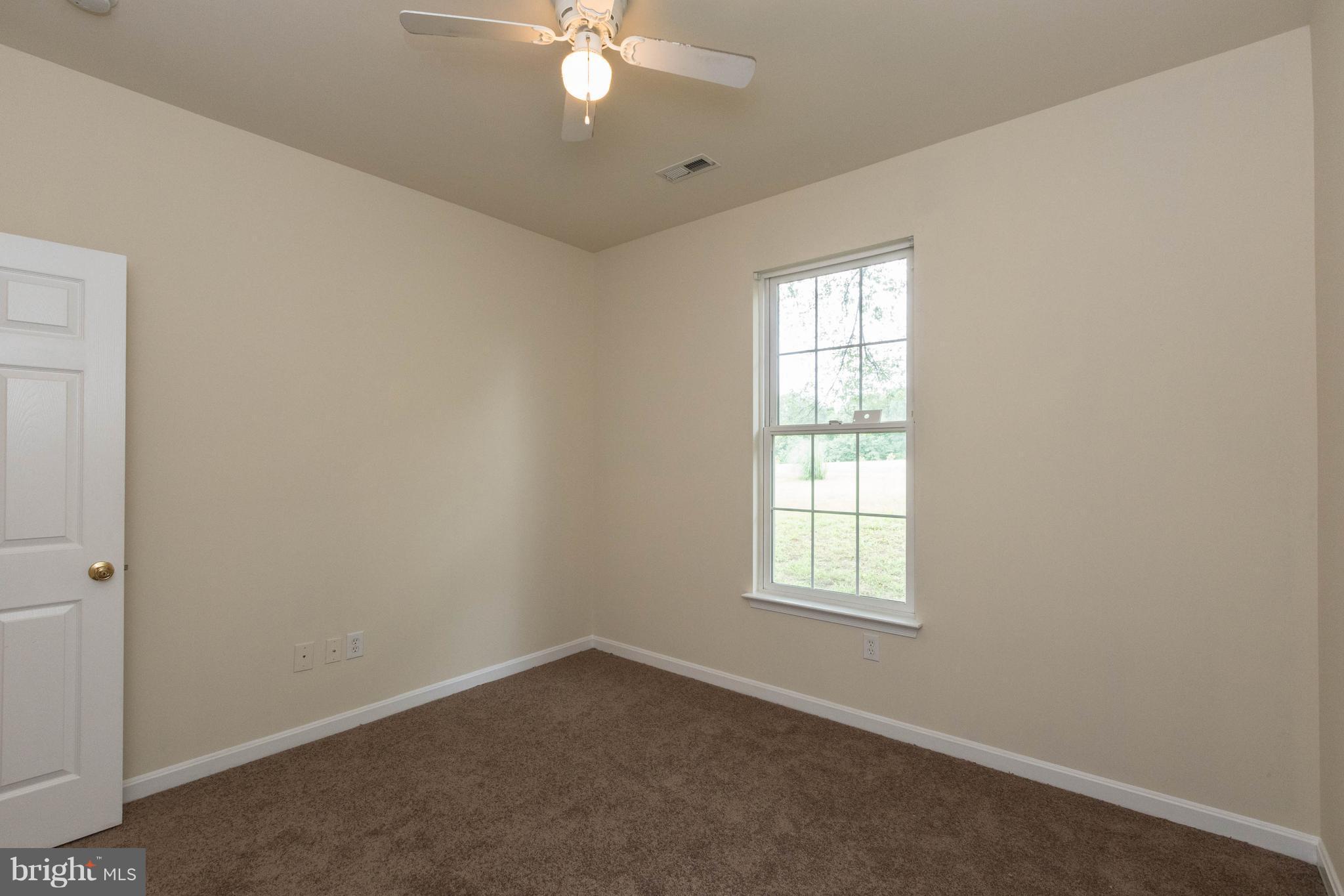 11207 Rawhide Road Lusby, MD 20657 - Photo 18 of 25 an empty room with a window