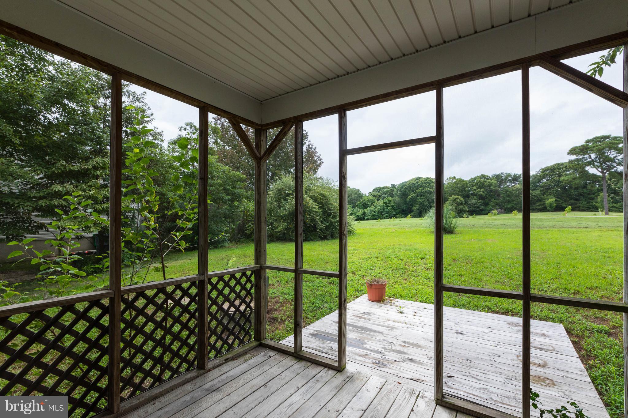 11207 Rawhide Road Lusby, MD 20657 - Photo 21 of 25 a view of deck with wooden floor