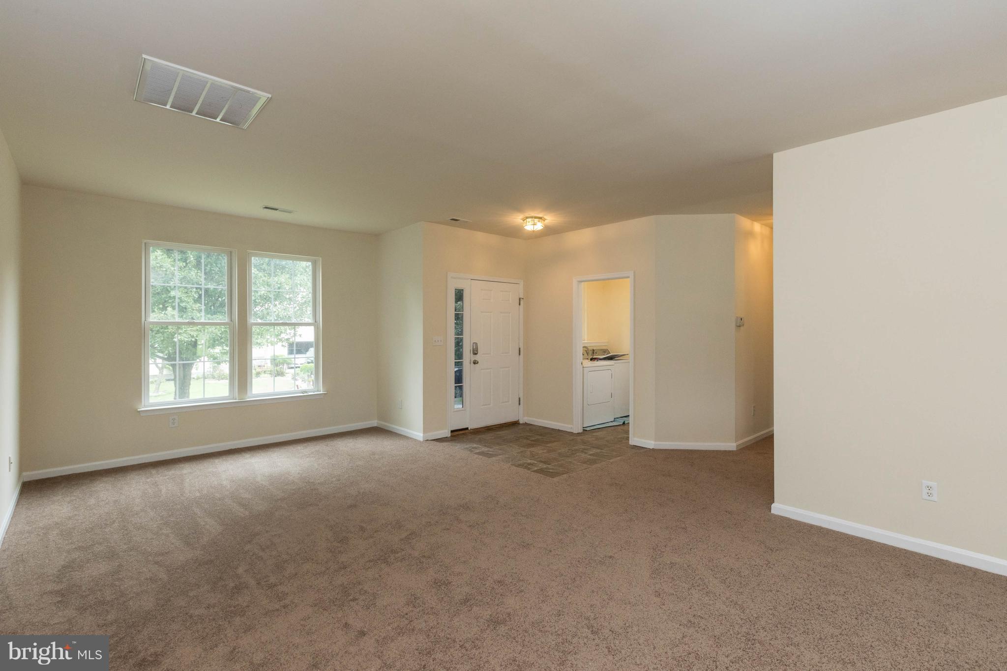 11207 Rawhide Road Lusby, MD 20657 - Photo 4 of 25 an empty room with windows