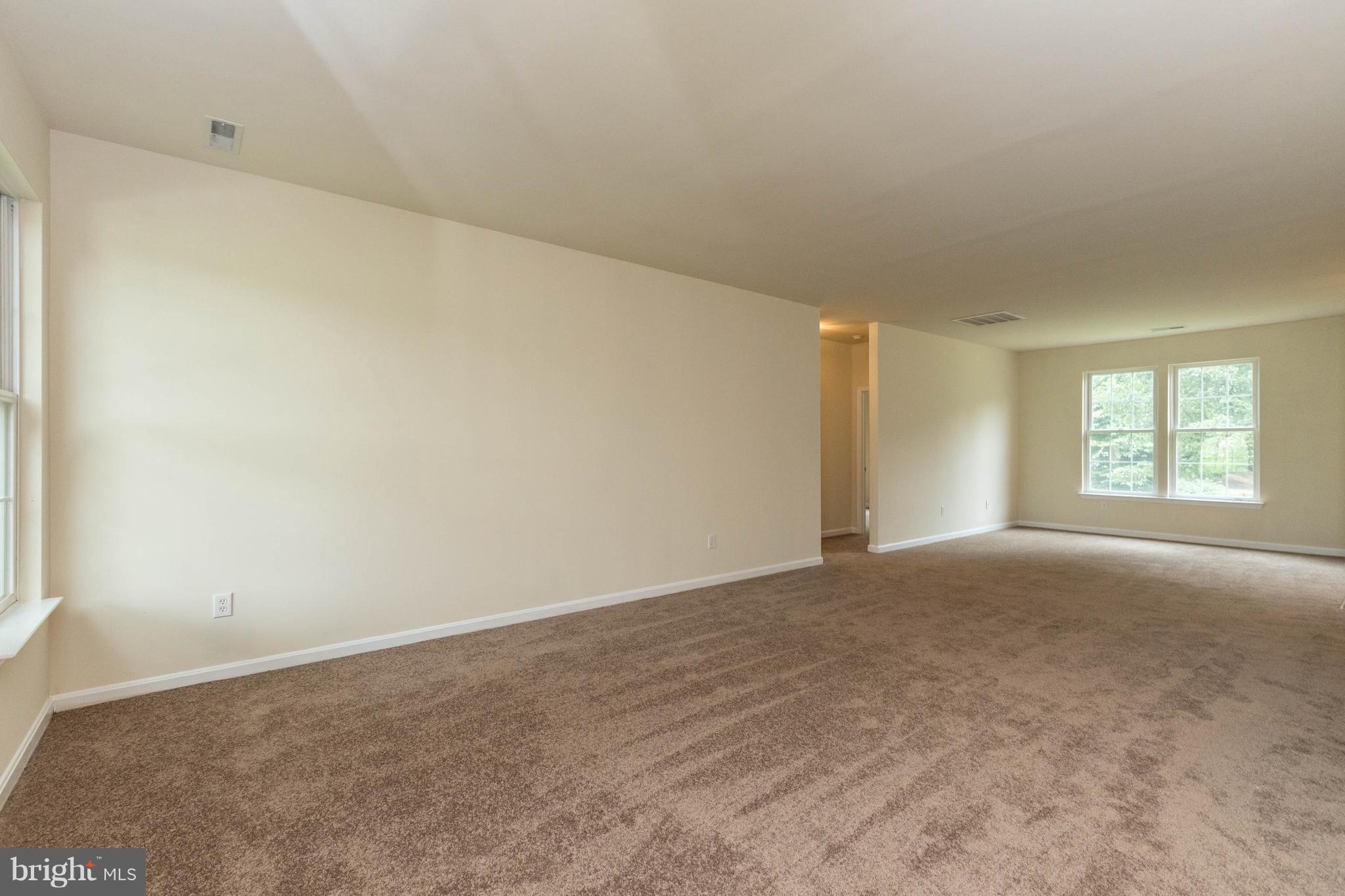 11207 Rawhide Road Lusby, MD 20657 - Photo 7 of 25 a view of an empty room with a window
