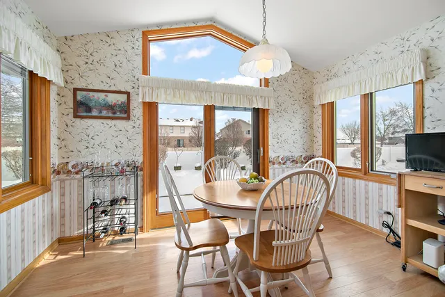 a view of a dining room with furniture window and outside view