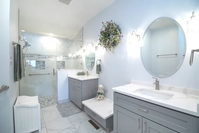a bathroom with a sink double vanity and a mirror